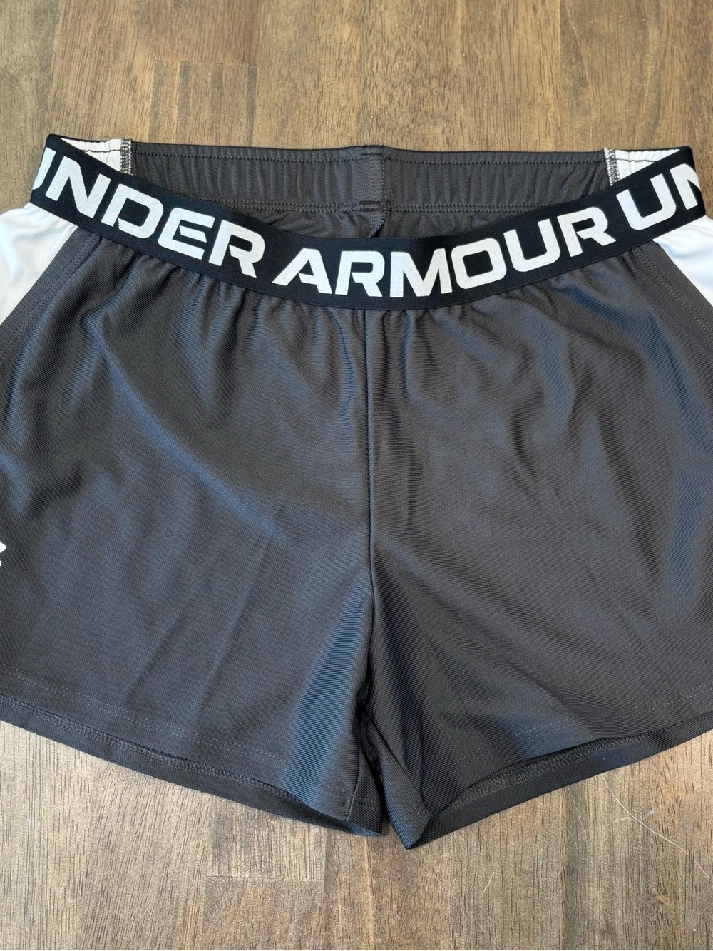 Under Armour Black Athletic Shorts with White Side Panels and Branded Waistband